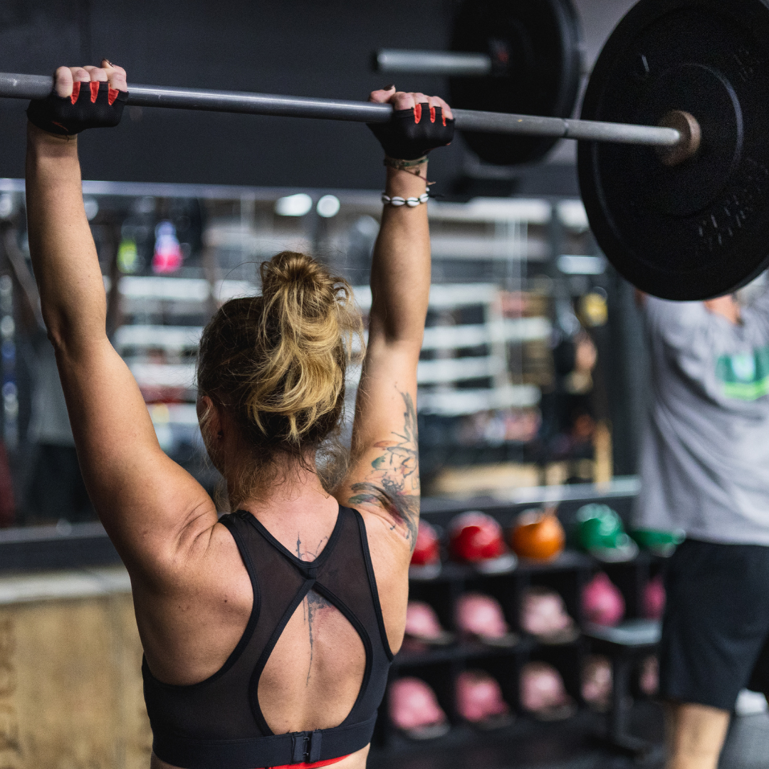Girl lifting a bar